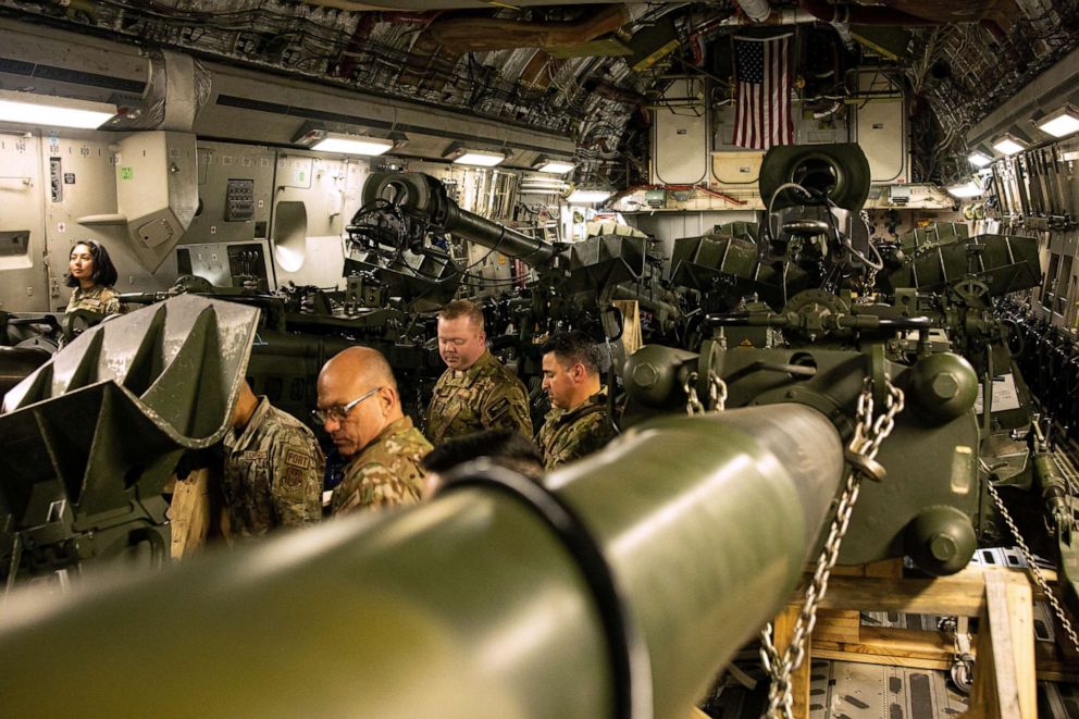 PHOTO: U.S. Marines load an M777 towed 155 mm howitzer into the cargo hold of a U.S. Air Force C-17 Globemaster III transport plane, to be delivered in Europe for Ukrainian forces, at March Air Reserve Base, California, April 21, 2022.
