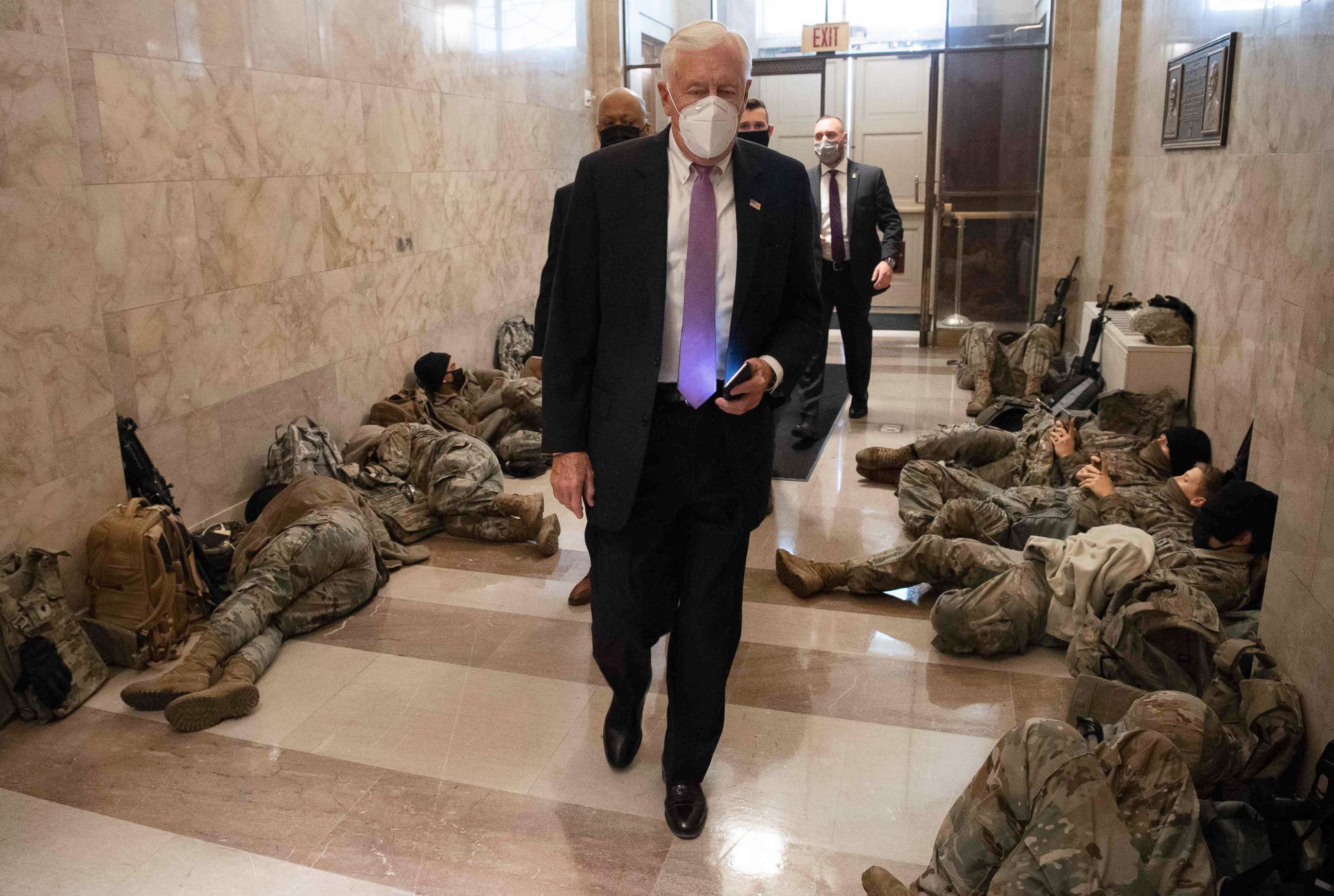 PHOTO: House Majority Leader Steny Hoyer, Democrat of Maryland, walks past members of the National Guard as he arrives at the U.S. Capitol, Jan. 13, 2021, ahead of an expected House vote impeaching President Donald Trump.