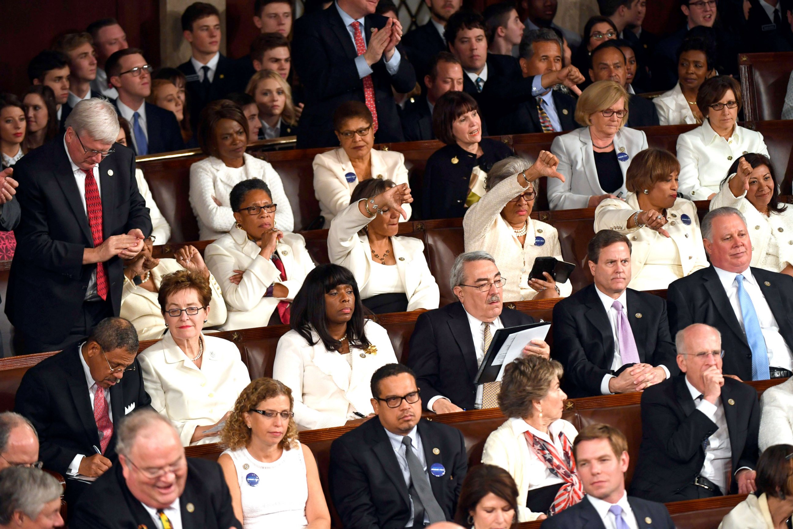 PHOTO: Members of Congress react as President Donald Trump addresses a joint session of Congress on Feb 28, 2017 in Washington, DC.