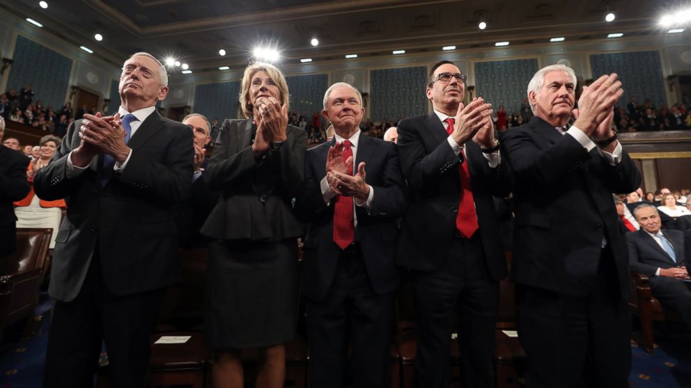 (L-R) Cabinet members James Mattis, Betsy DeVos, Jeff Sessions, Steve Mnuchin and Rex Tillerson applaud as President Donald Trump addresses a joint session of Congress at the U.S. Capitol, Feb 28, 2017.