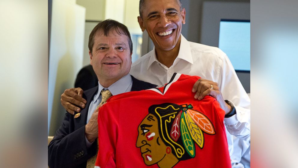 PHOTO: President Obama and Rep. Mike Quigley pose with a Chicago Blackhawks jersey during a flight on Air Force One on June 6, 2015.