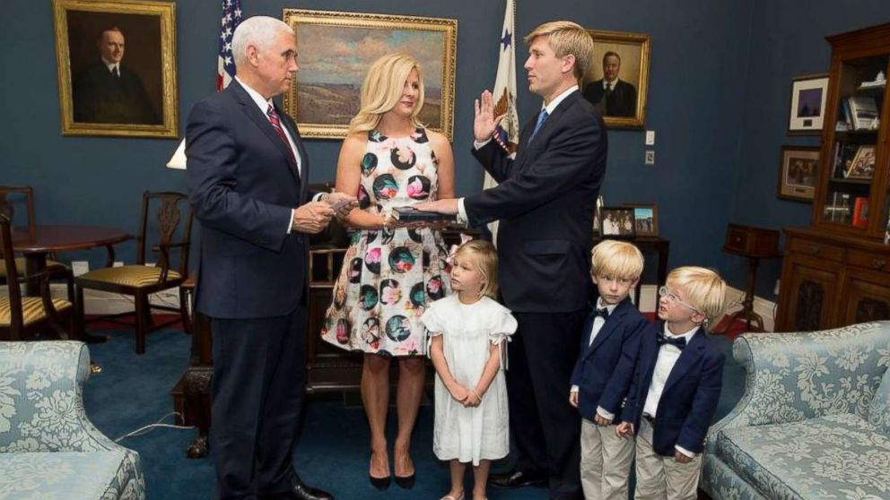 Vice President Mike Pence swears in his new chief of staff, Nick Ayers, who was joined by his wife and three children at the White House on July 28, 2017.