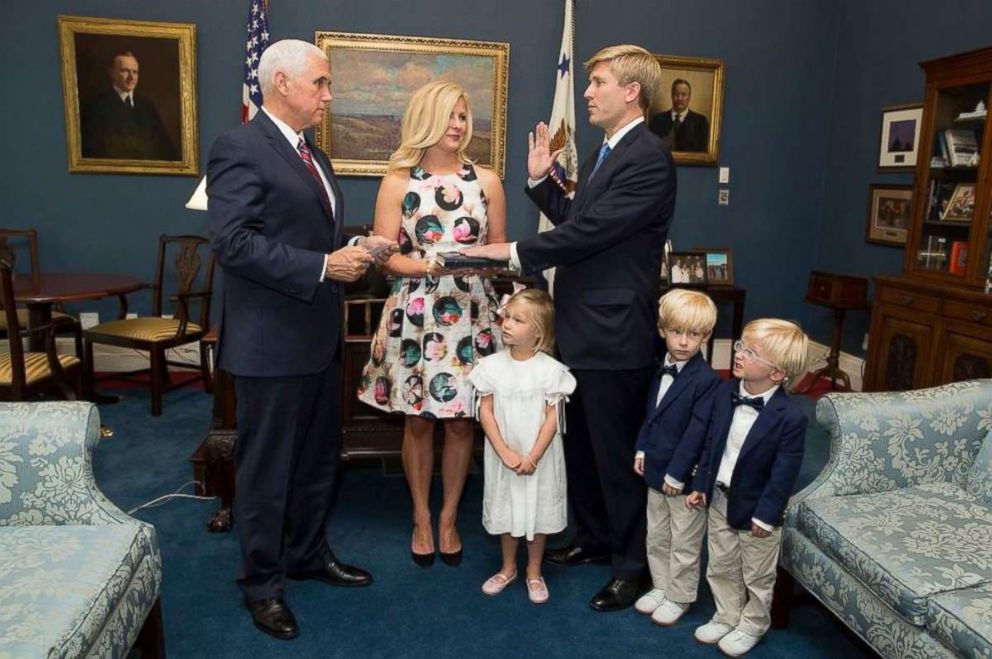 PHOTO: Vice President Mike Pence swears in his new chief of staff, Nick Ayers, who was joined by his wife and three children at the White House on July 28, 2017.