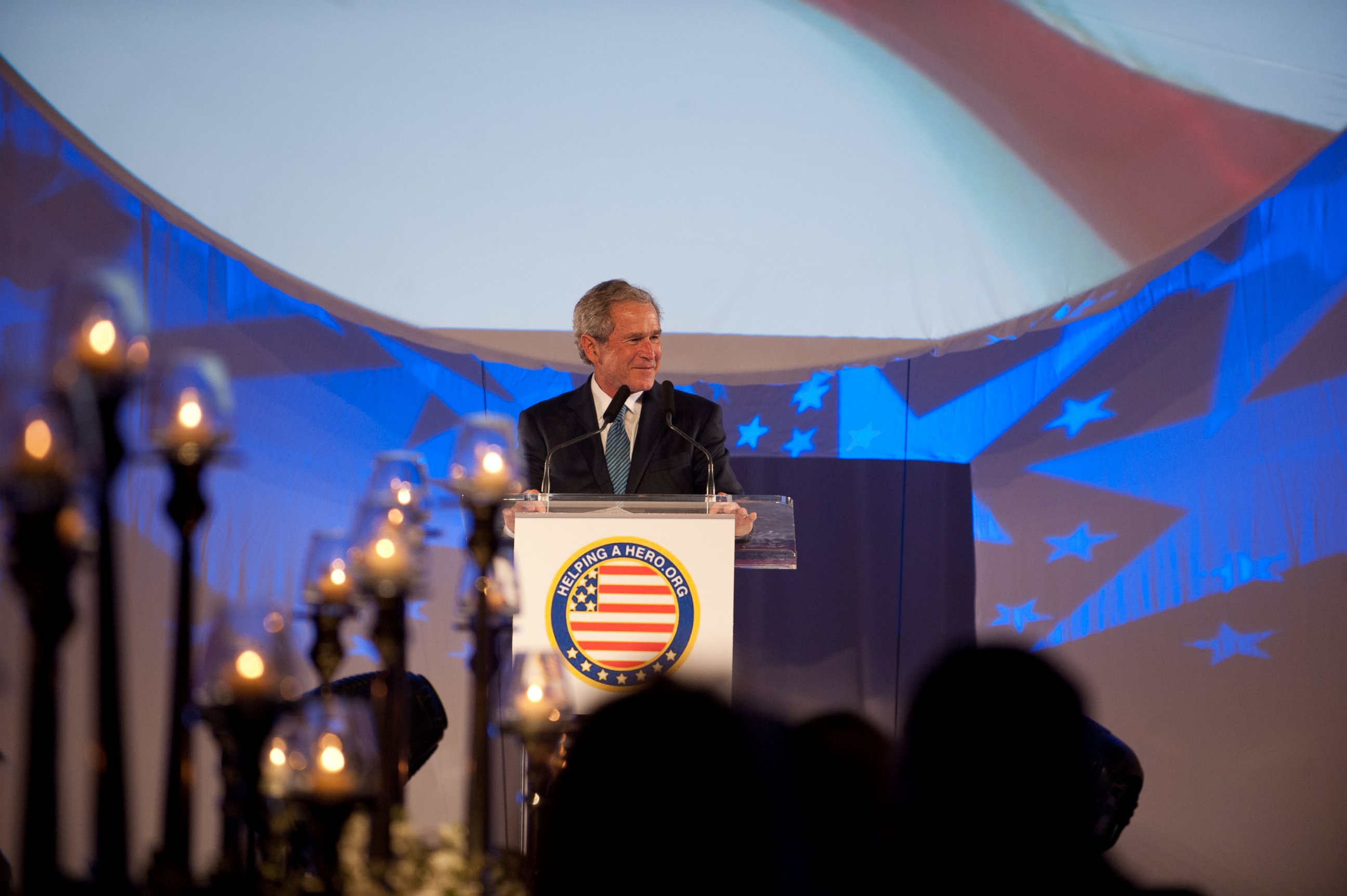 PHOTO: Former President George W. Bush speaks at an event for the Helping a Hero charity in 2012.