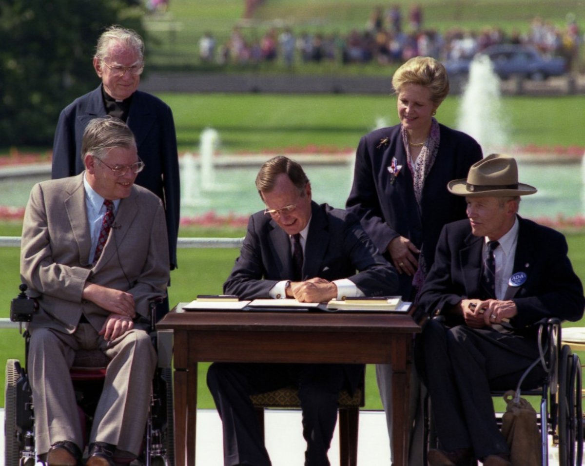 PHOTO: President George H. W. Bush Signs the Americans with Disabilities Act, July 26, 1990. 