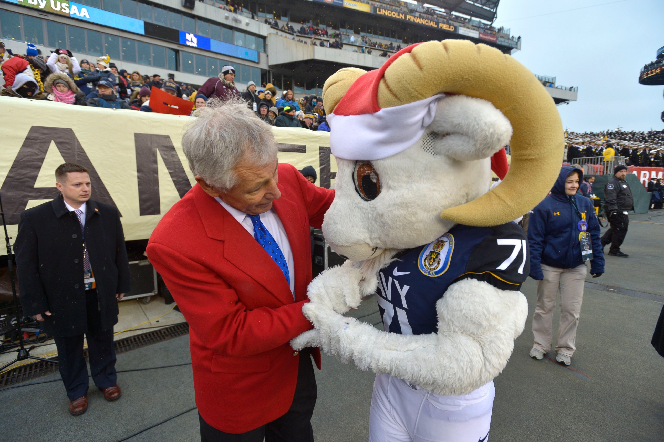 PHOTO: Secretary of Defense Chuck Hagel chats with the Navy mascot on the sidelines of the Army vs. Navy game in Philadelphia, Pa. on Dec. 14, 2013.