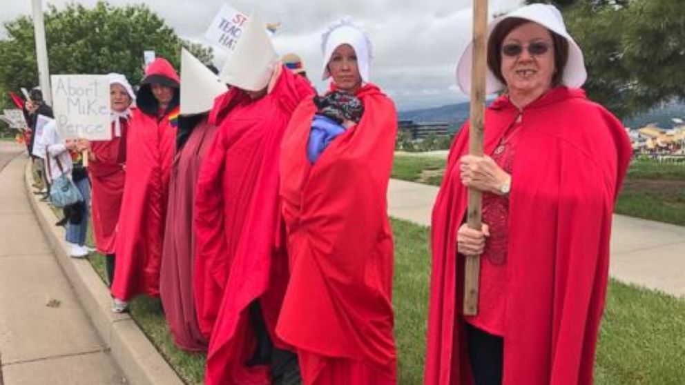 PHOTO: Protesters outfitted in red robes and white bonnets -- the signature get-up worn by "handmaids" in "The Handmaid's Tale" -- greeted VP Mike Pence outside a speaking engagement in Colorado Springs, Colorado, on June 23, 2017, at Focus on the Family.