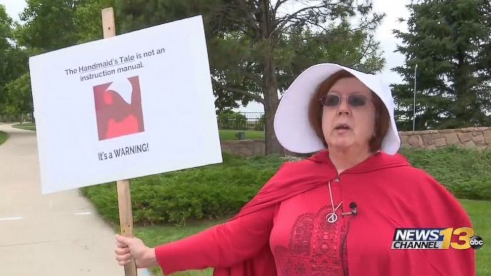 PHOTO: Protesters outfitted in red robes and white bonnets -- the signature get-up worn by "handmaids" in "The Handmaid's Tale" -- greeted VP Mike Pence outside a speaking engagement in Colorado Springs, Colorado, on June 23, 2017, at Focus on the Family.