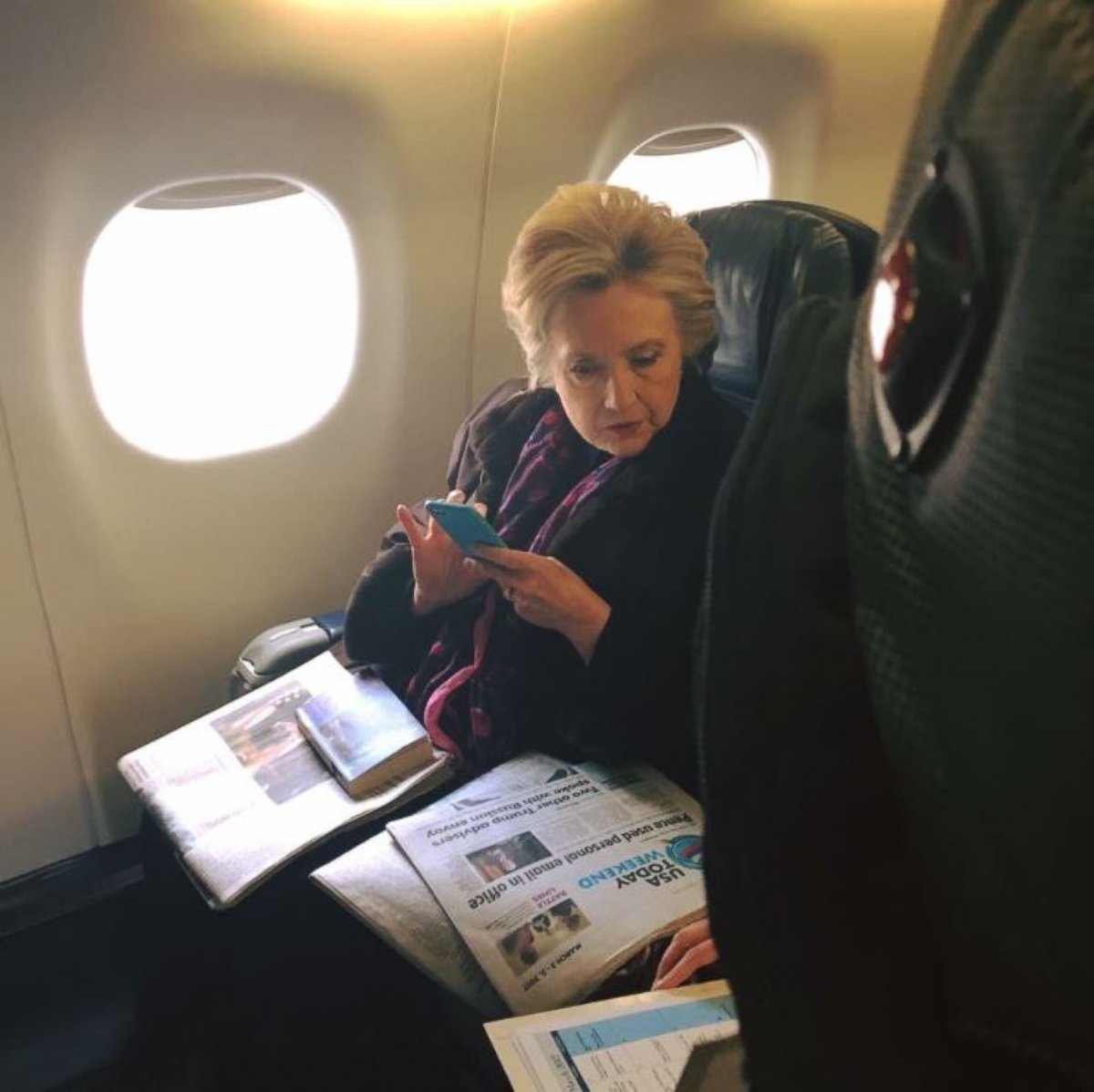 PHOTO: Hillary Clinton was photographed on March 3, 2017, by a fellow passenger on a Boston to New York flight, reading a USA Today cover story about Mike Pence''''s use of personal email while governor of Indiana.