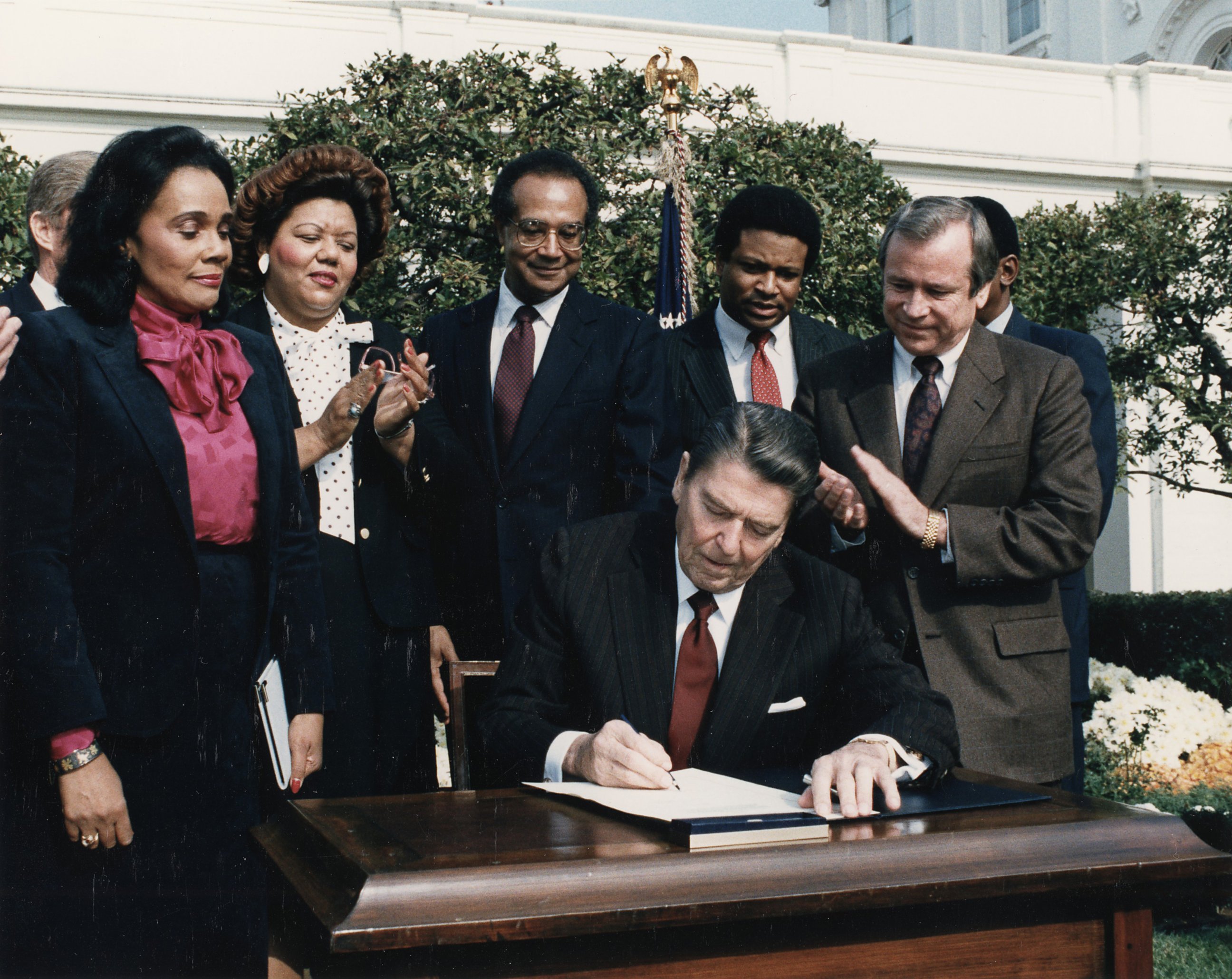 PHOTO: President Ronald Reagan signs legislation to create a federal holiday honoring Martin Luther King, Jr. in the Rose Garden of the White House, Nov. 2, 1983. 