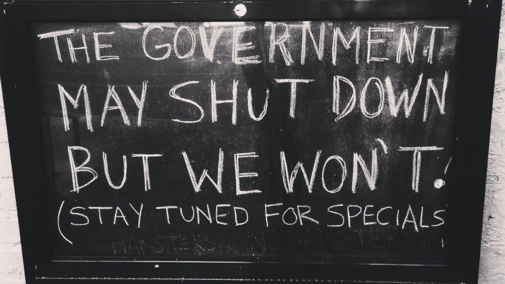 A sign at Union Pub in Washington, D.C. advertises drink specials following the government shutdown on Jan. 20, 2018.