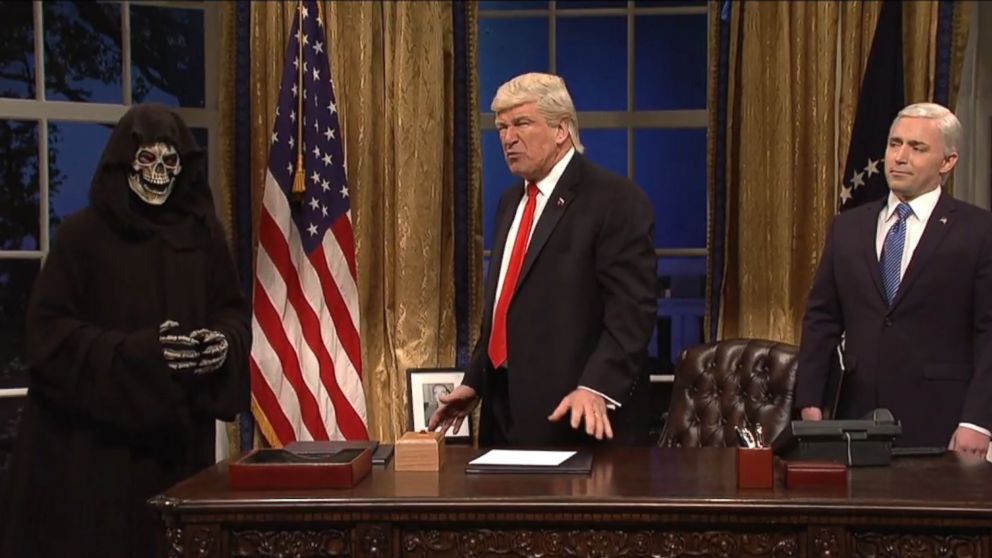 PHOTO: Alec Baldwin, portraying Donald Trump, is flanked by "Saturday Night Live" cast member Beck Bennett as Mike Pence, and the Grim Reaper, who is supposed to be White House chief strategist Steve Bannon, on "Saturday Night Live" on April 15, 2017.