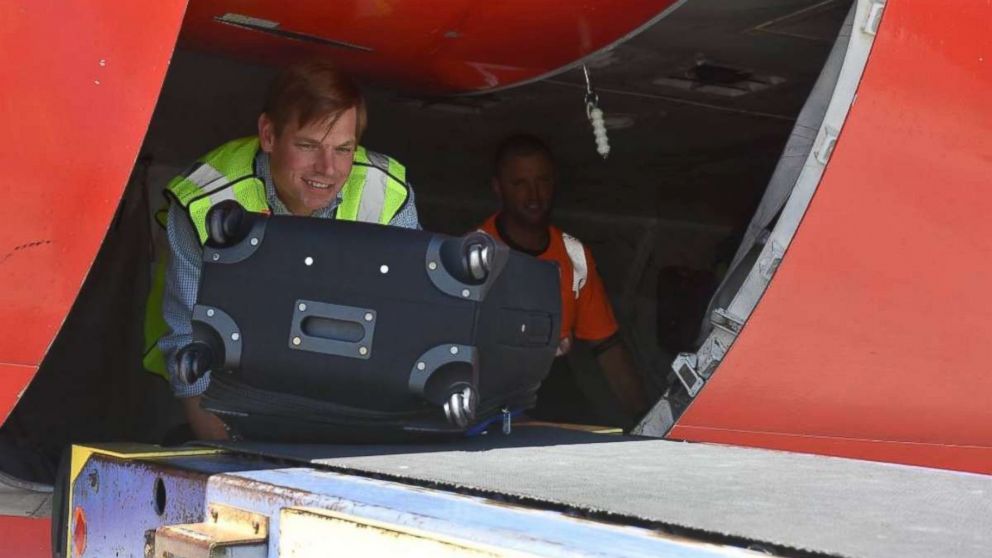 Rep. Eric Swalwell, D-Calif., takes a stab as a baggage handler for Southwest Airlines at Oakland International Airport on July 22, 2017, as part of the #InYourShoes initiative.