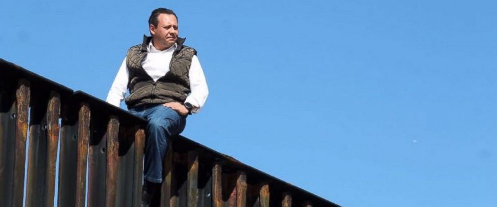 Mexican congressman climbs U.S. border fence to illustrate that Trump's ...