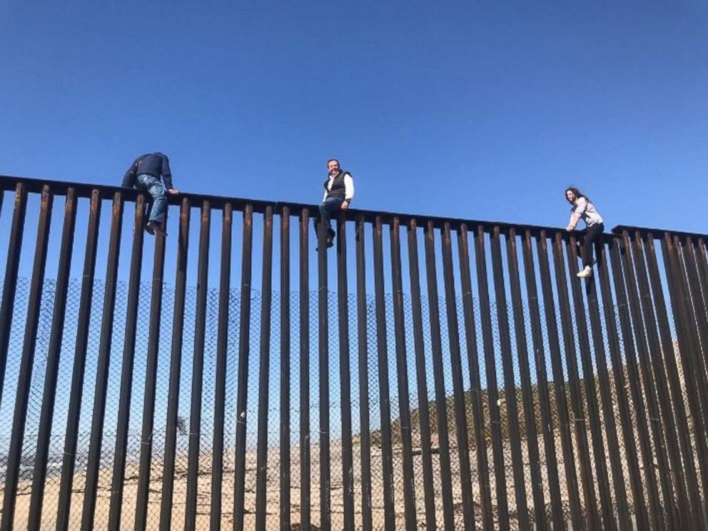 PHOTO: Mexican congressman Braulio Guerra sits atop the U.S.-Mexico border wall that divides Tijuana, Mexico, from California on March 1, 2017