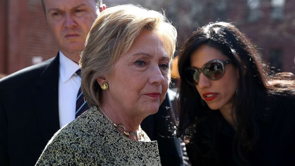 PHOTO: Democratic presidential candidate former Secretary of State Hillary Clinton (L) talks with aide Huma Abedin (R) before speaking at a neighborhood block party on April 17, 2016 in New York City. 