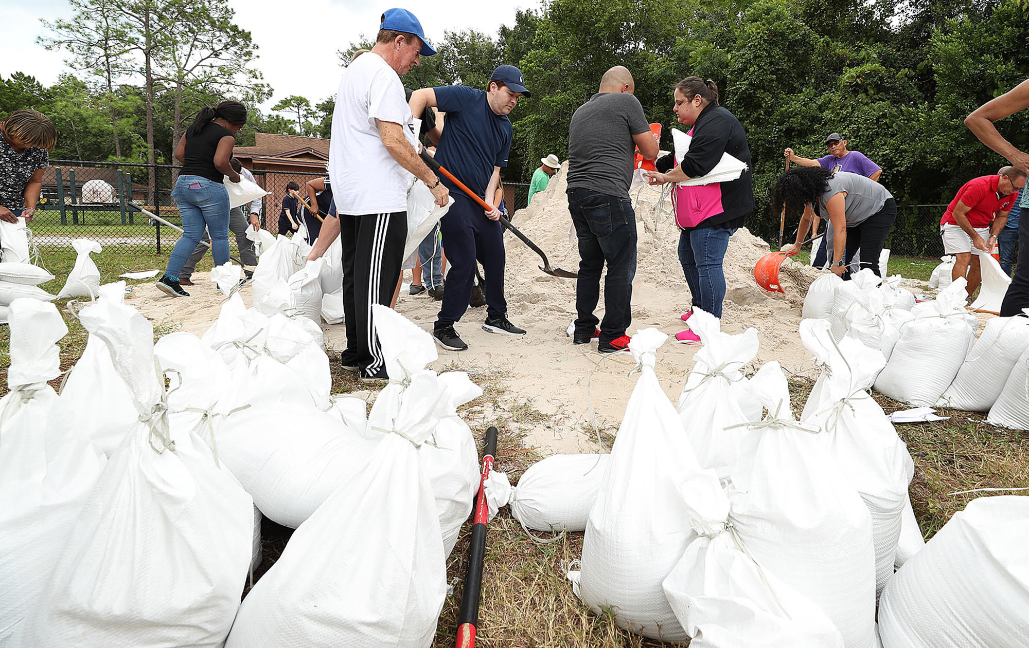 PHOTO: Dozens of Orange County residents fill sandbags in advance of Hurricane Dorian at Blanchard Park in Orlando, Fla. on Aug. 28, 2019.