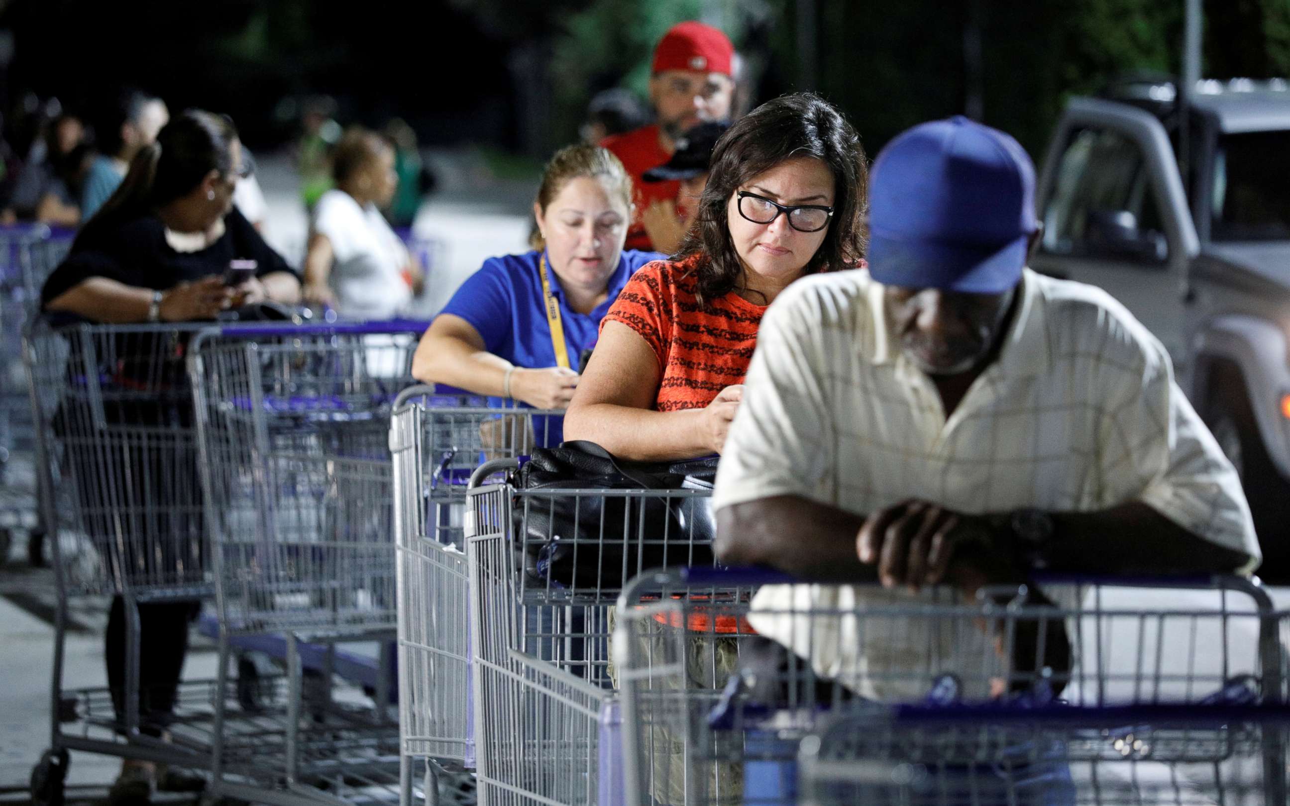 PHOTO: Shoppers wait in line for a Sam's Club store to open before sunrise, as people rushed to buy supplies ahead of the arrival of Hurricane Dorian in Kissimmee, Fla., Aug. 30, 2019.