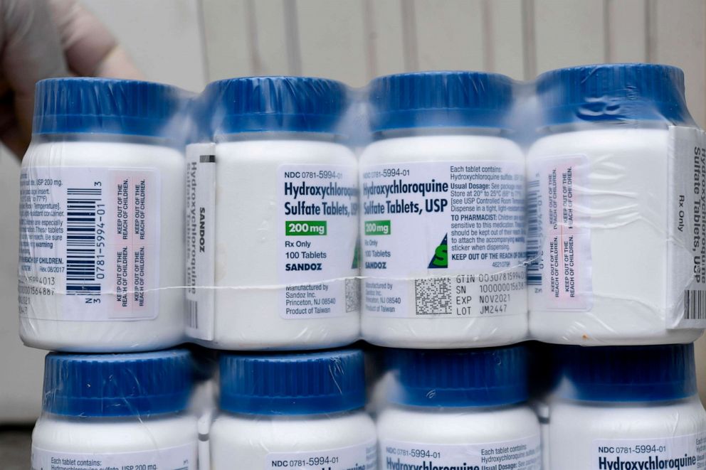 PHOTO: A Salvadoran Health Ministry worker shows a package of bottles of HydroxyChloroquine pills to be distributed in hospitals in San Salvador, amid the COVID-19 coronavirus outbreak, April 21, 202.