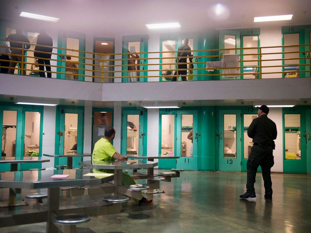 PHOTO: A sheriffs deputy talks to an immigration detainee in a high security housing unit at the Theo Lacy Facility, a county jail which also houses immigration detainees arrested by the US Immigration and Customs Enforcement (ICE), March 14, 2017.