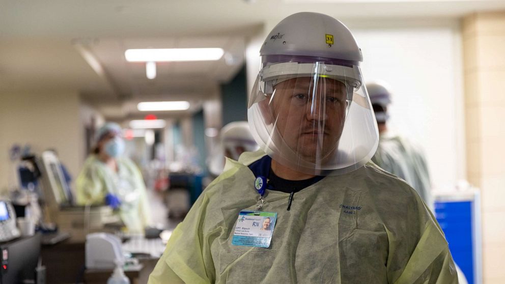 PHOTO: Army Capt. Shane Blanch, a critical care nurse assigned to the 627th Hospital Center, shadows local hospital staff during the COVID-19 response operations at Kootenai Health regional medical center in Coeur D'Alene, Idaho, Sept. 6, 2021.