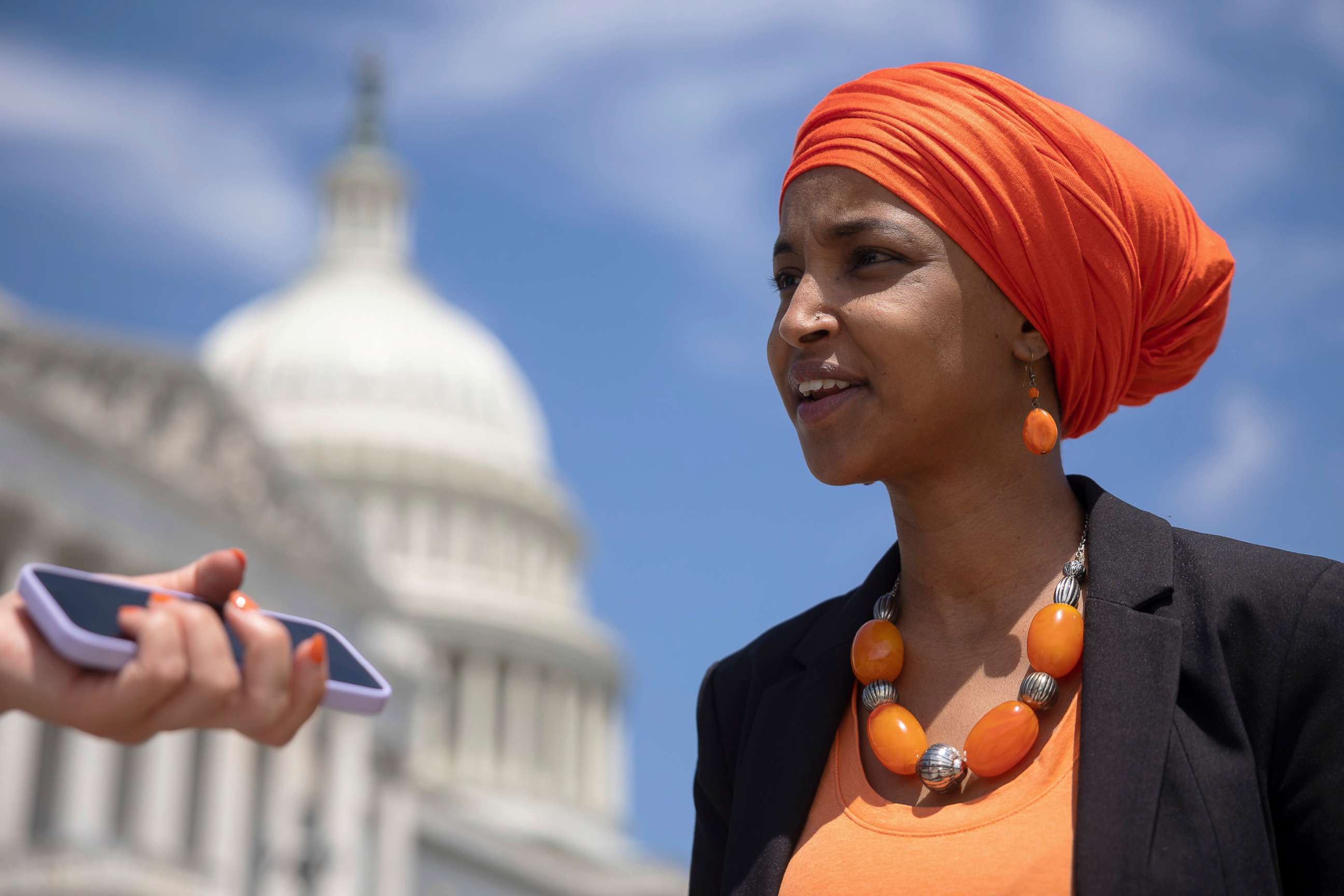 PHOTO: Rep. Ilhan Omar speaks to a reporter before a press conference outside the U.S. Capitol, on July 19, 2022, in Washington, D.C.