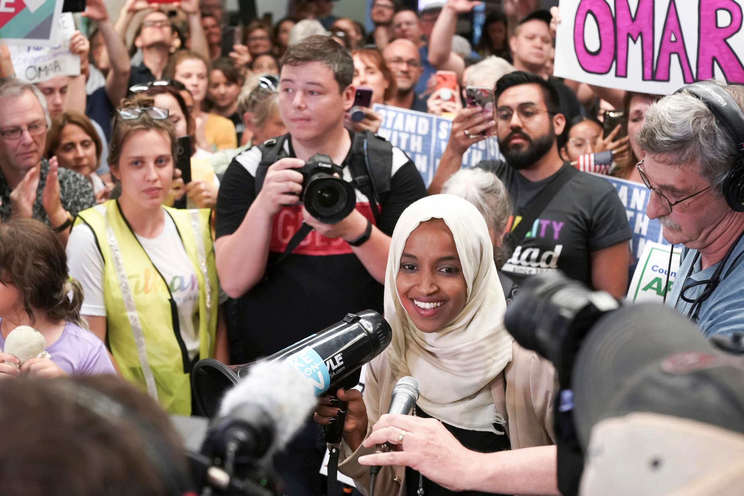 PHOTO: Rep. Ilhan Omar speaks to supporters as she arrives at Minneapolis' Saint Paul International Airport, July 18, 2019, in Minnesota. 