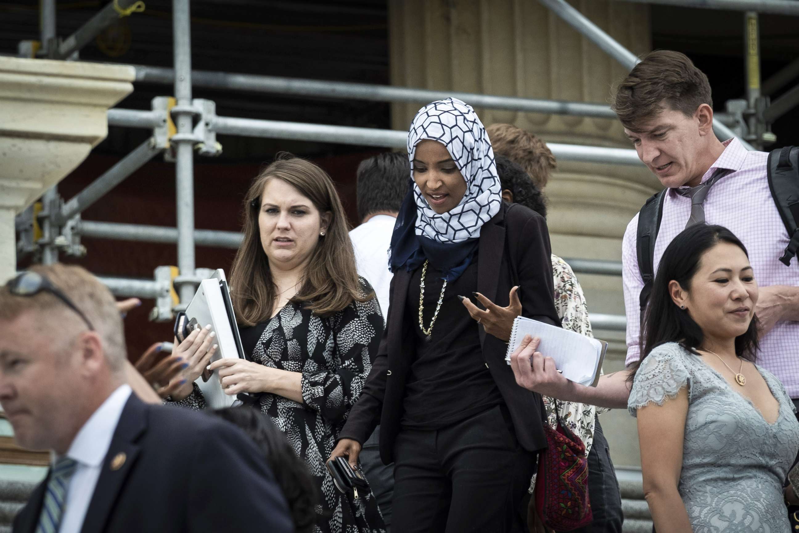 PHOTO: Rep. Ilhan Omara speaks to a reporter after voting for a resolution denouncing comments by President Trump targeting herself and three other progressive Democratic congresswomen of color, July 16, 2019, in Washington, DC.