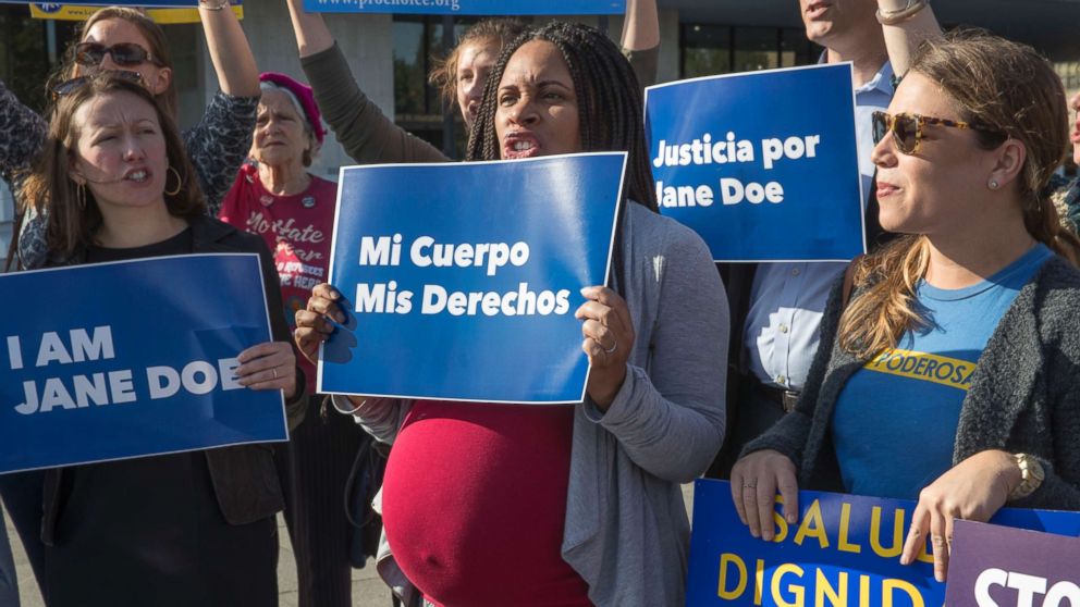 PHOTO: Activists with Planned Parenthood demonstrate in support of a pregnant 17-year-old being held in a Texas facility for unaccompanied immigrant children to obtain an abortion, outside of the Department of Health and Human Services, Oct. 20, 2017.
