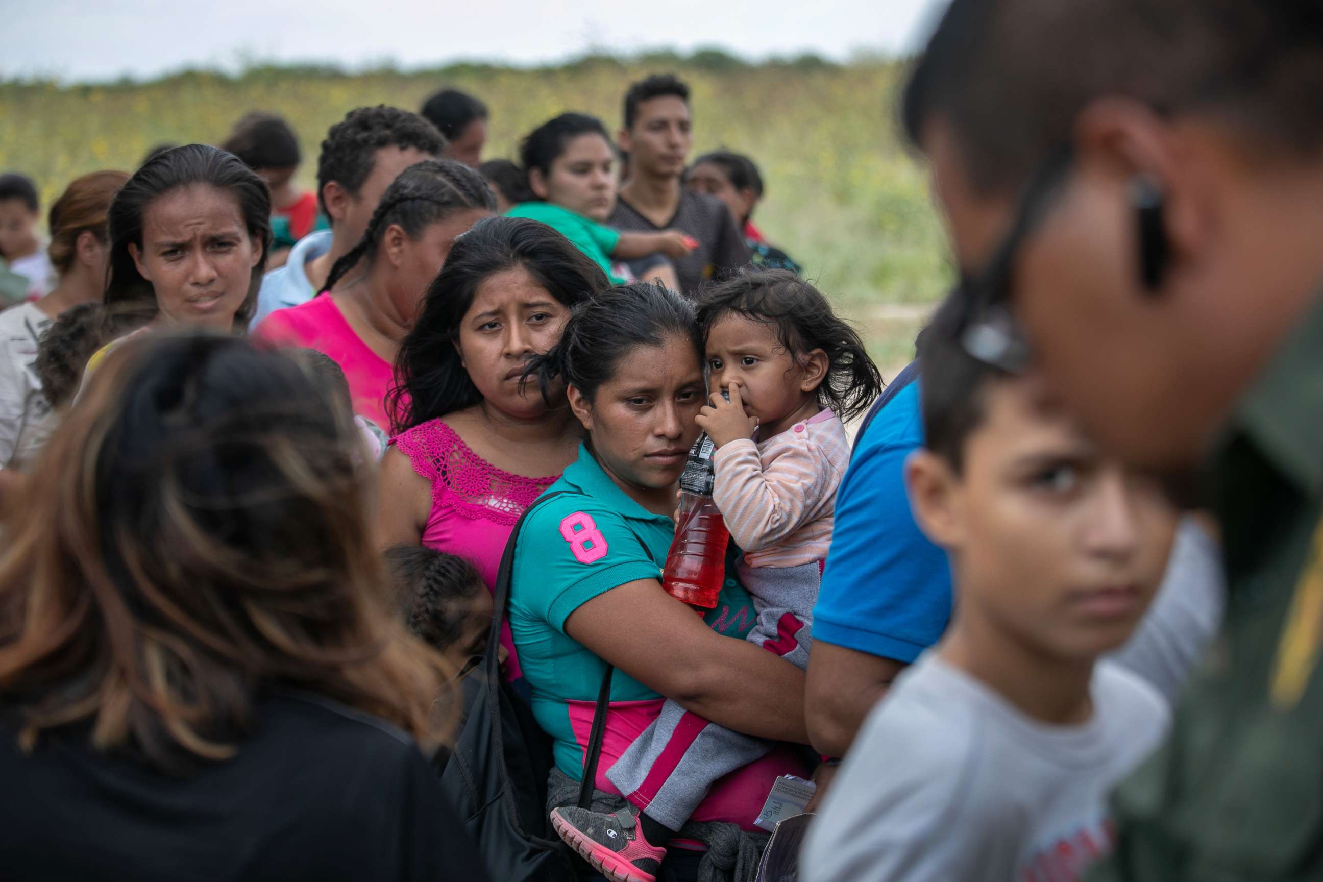 PHOTO:  A U.S. Border Patrol agent instructs immigrants after they were taken into custody on July 02, 2019 in Los Ebanos, Texas. 