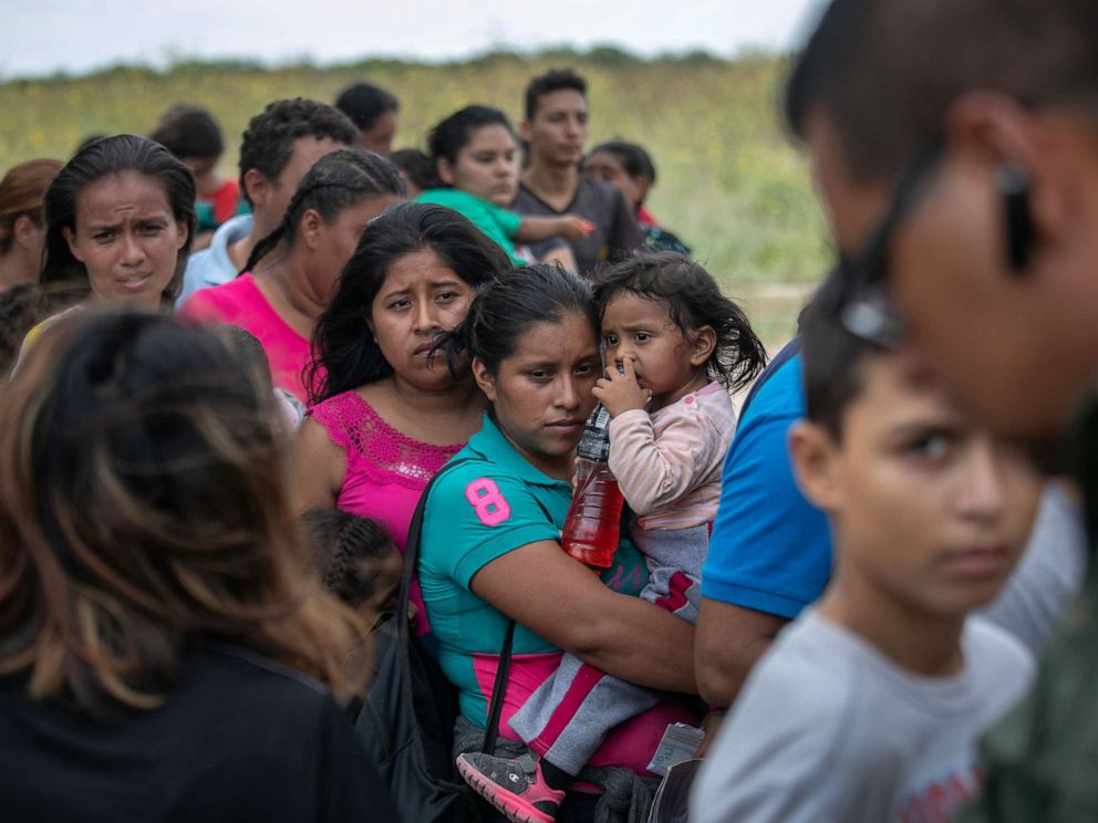 PHOTO: A U.S. Border Patrol agent instructs immigrants after they were taken into custody on July 02, 2019 in Los Ebanos, Texas.