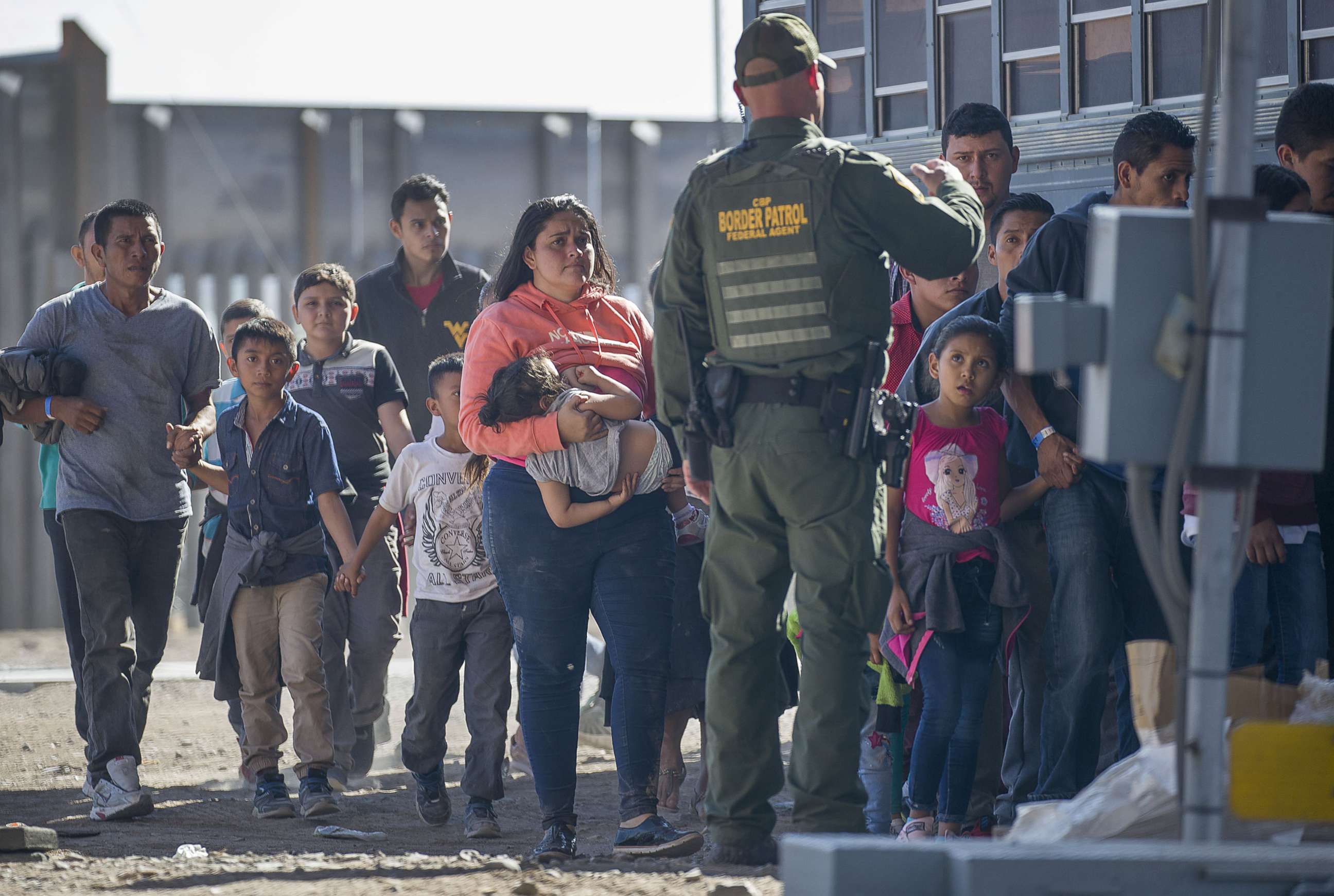 PHOTO: Migrants are loaded onto a bus by U.S. Border Patrol agents after being detained when they crossed  into the United States from Mexico on June 01, 2019 in El Paso, Texas.