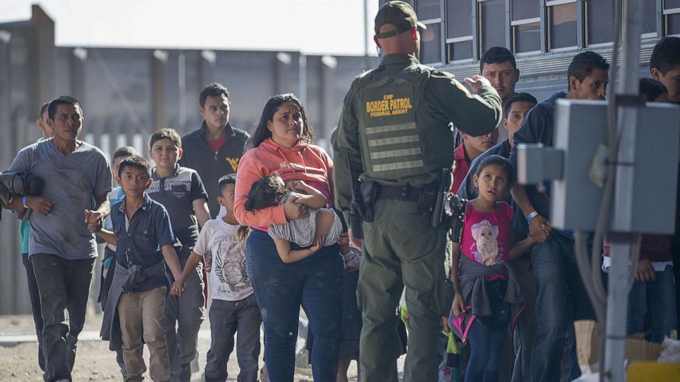 PHOTO: Migrants are loaded onto a bus by U.S. Border Patrol agents after being detained when they crossed  into the United States from Mexico on June 01, 2019 in El Paso, Texas.