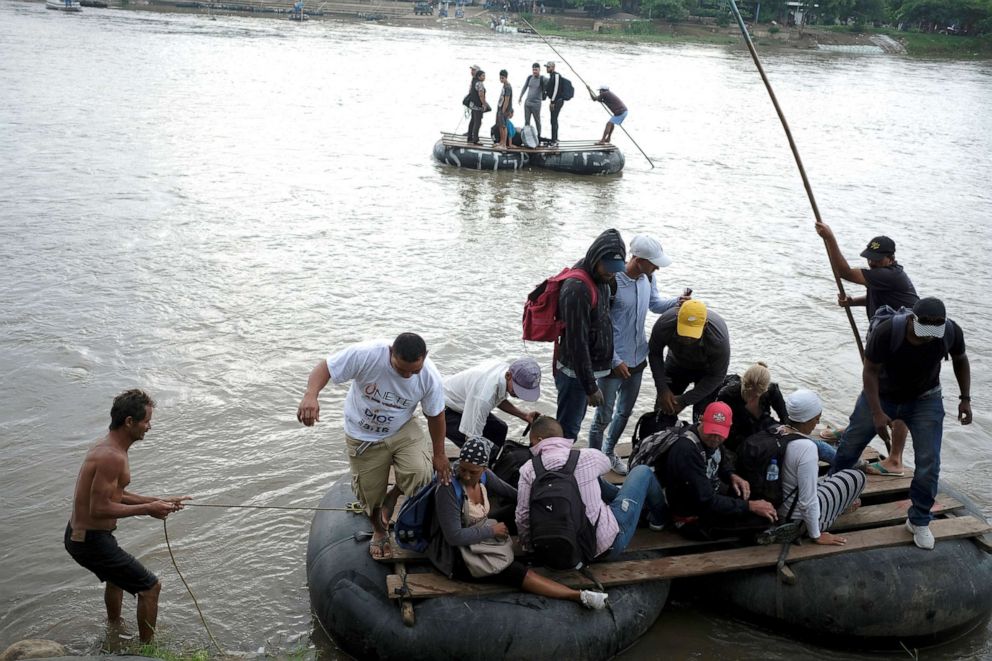 PHOTO: Central American migrants get off a raft after crossing the Suchiate river from Tecun Uman, in Guatemala, to Ciudad Hidalgo, as seen from Ciudad Hidalgo, Mexico, June 11, 2019.