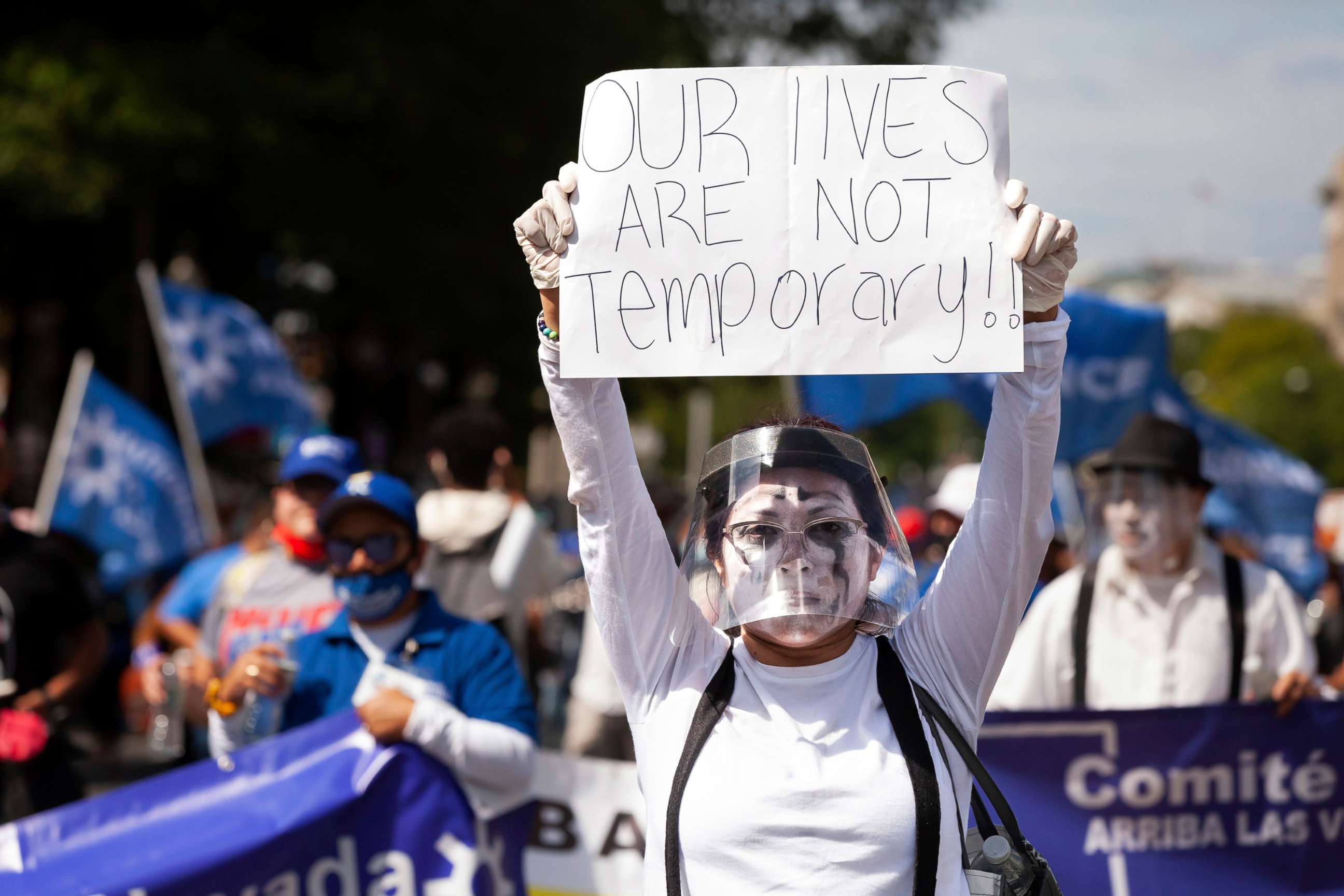 PHOTO: A protester plays carries a sign with one of the main themes of the National TPS Alliance march for permanent residency for immigrants with temporary protected status in Washington, Sept. 20, 2021.