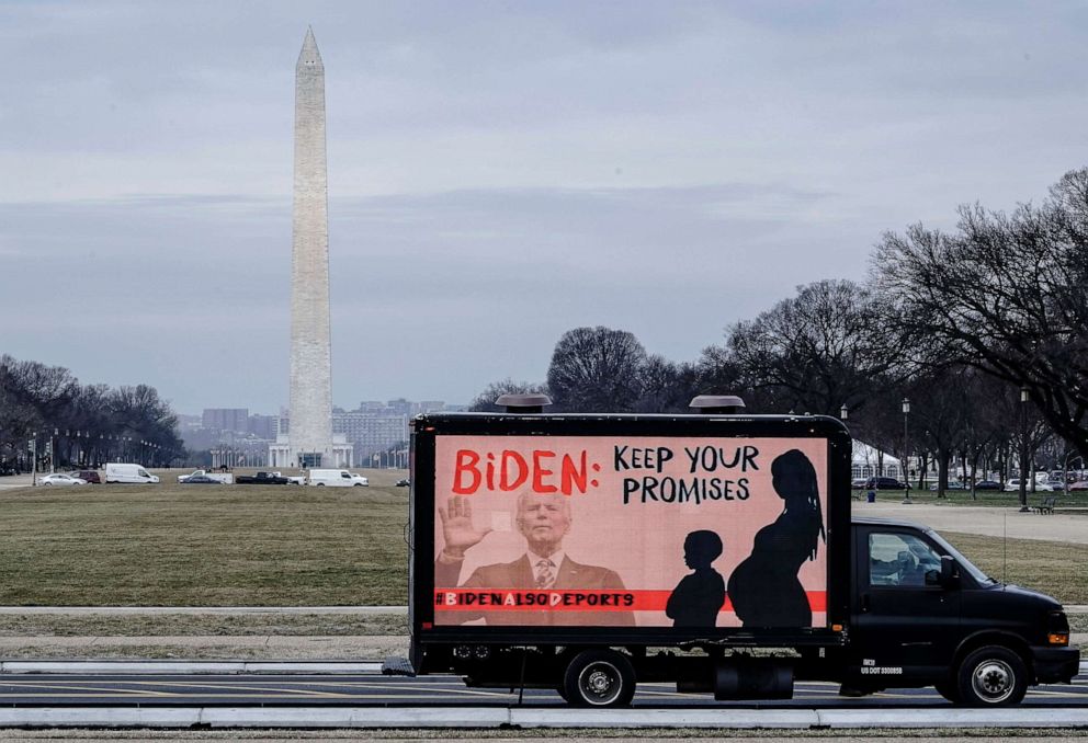 PHOTO: WAn L.E.D. truck displaying messages of concern over the continuing mass deportations of Black immigrants drives past the Washington Monument prior to a #BidenAlsoDeports rally on Feb. 15, 2021, in Washington, D.C..