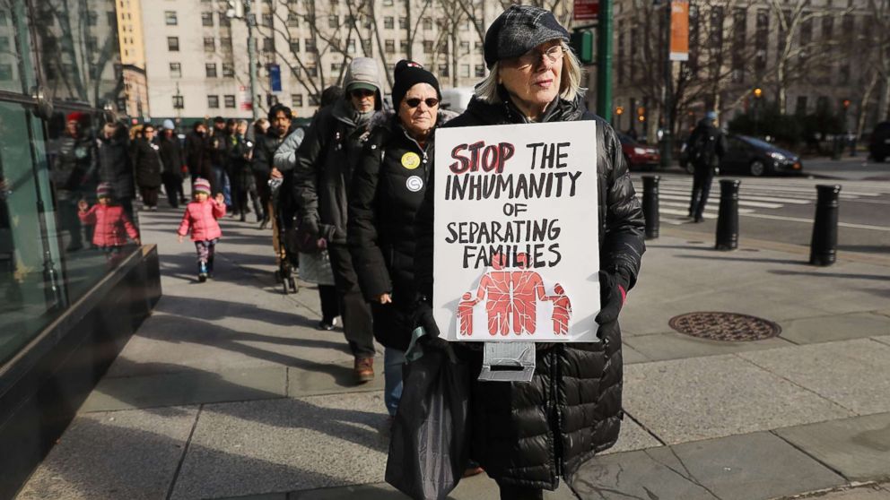 A woman carries a sign in a demonstration where immigration activists, clergy members and others gathered against the imprisonment and potential deportation of an immigration activist in front of the Federal Building on Jan. 29, 2018 in New York.