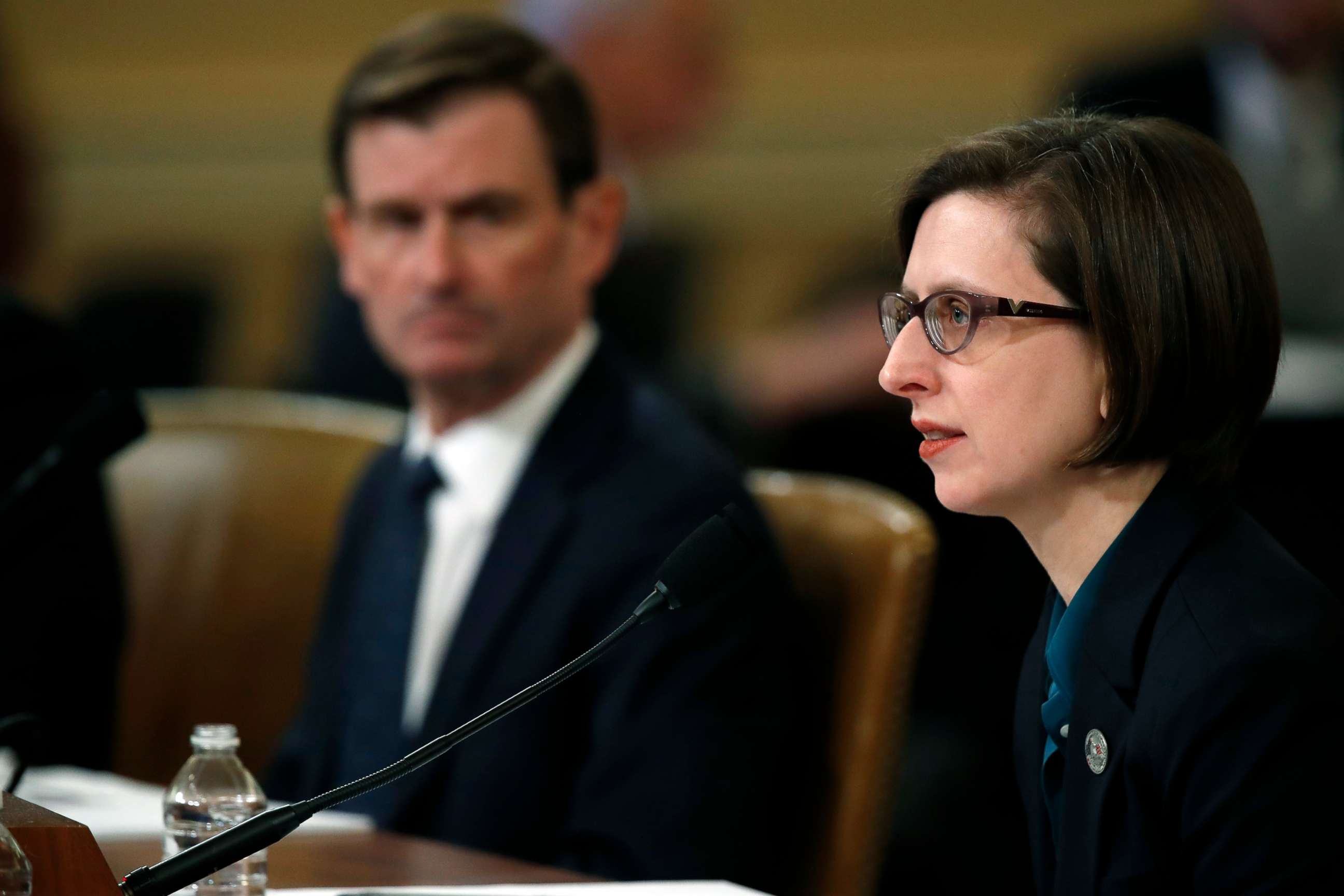 PHOTO: Deputy Assistant Secretary of Defense Laura Cooper, and State Department official David Hale, left, testify before the House Intelligence Committee on Capitol Hill, Nov. 20, 2019.