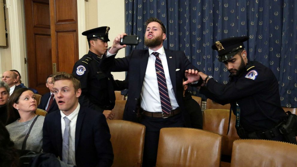 PHOTO: A supporter of President Donald Trump screams criticism at House Judiciary Committee Chairman Rep. Jerrold Nadler at the start of a House Judiciary Committee hearing to receive counsel presentations of evidence on the impeachment inquiry.