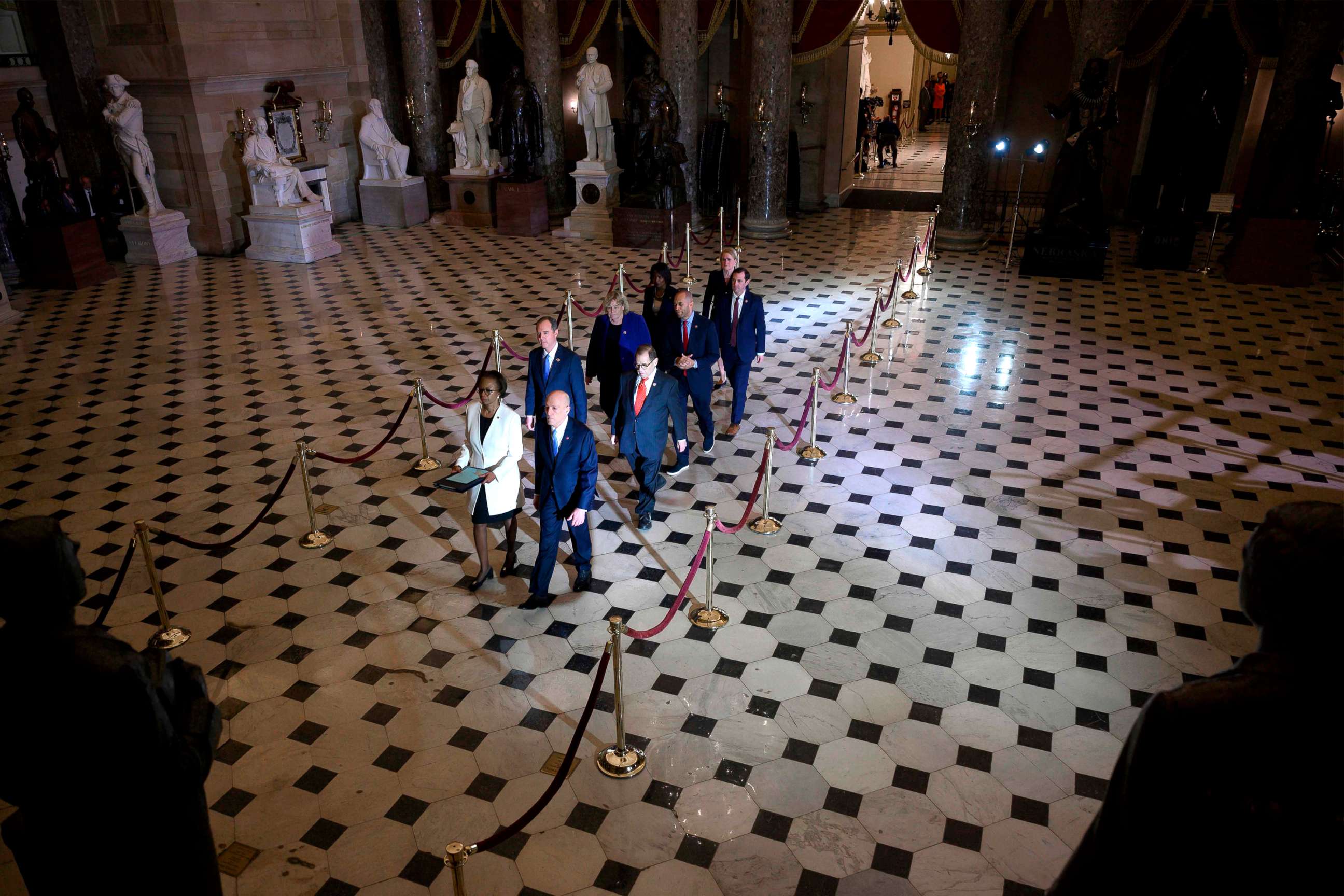 PHOTO: House Managers walk to the US Senate to deliver the Articles of Impeachment against US President Donald Trump on Capitol Hill, Jan. 15, 2020, in Washington, DC.
