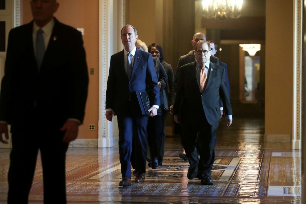 PHOTO: House impeachment managers walk through the Ohio Clock Corridor as they arrive for the procedural start of the Senate impeachment trial of President Donald Trump in the Capitol in Washington, Jan. 16, 2020.