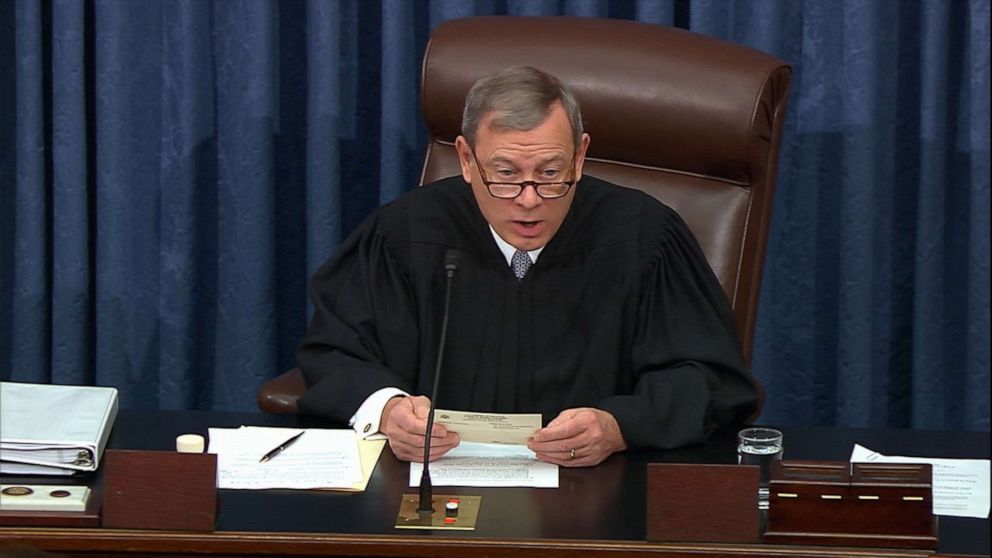 PHOTO: Supreme Court Chief Justice John Roberts reads a question during the impeachment trial against President Donald Trump in the Senate in Washington, Jan. 30, 2020.