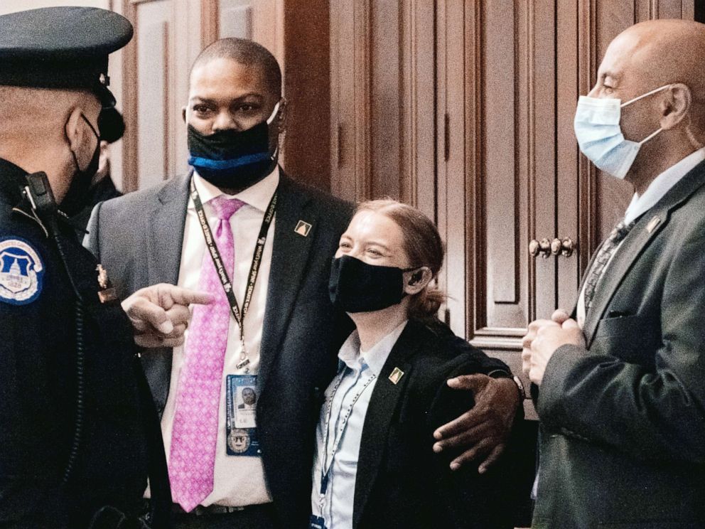 PHOTO: Capitol Police Officer Eugene Goodman speaks with fellow officers during the second day of the impeachment trial of former President Donald Trump in Washington,Feb. 10, 2021.