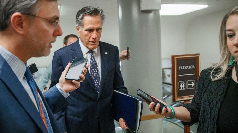 PHOTO:Republican Sen. Mitt Romney responds to a question from the news media on his way to the impeachment trial in the US Capitol in Washington, Jan. 2020.