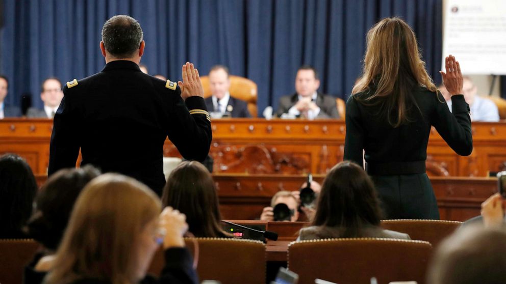 PHOTO: National Security Council aide Lt. Col. Alexander Vindman, left, and Jennifer Williams, an aide to Vice President Mike Pence are sworn in to testify before the House Intelligence Committee on Capitol Hill in Washington, Nov. 19, 2019.