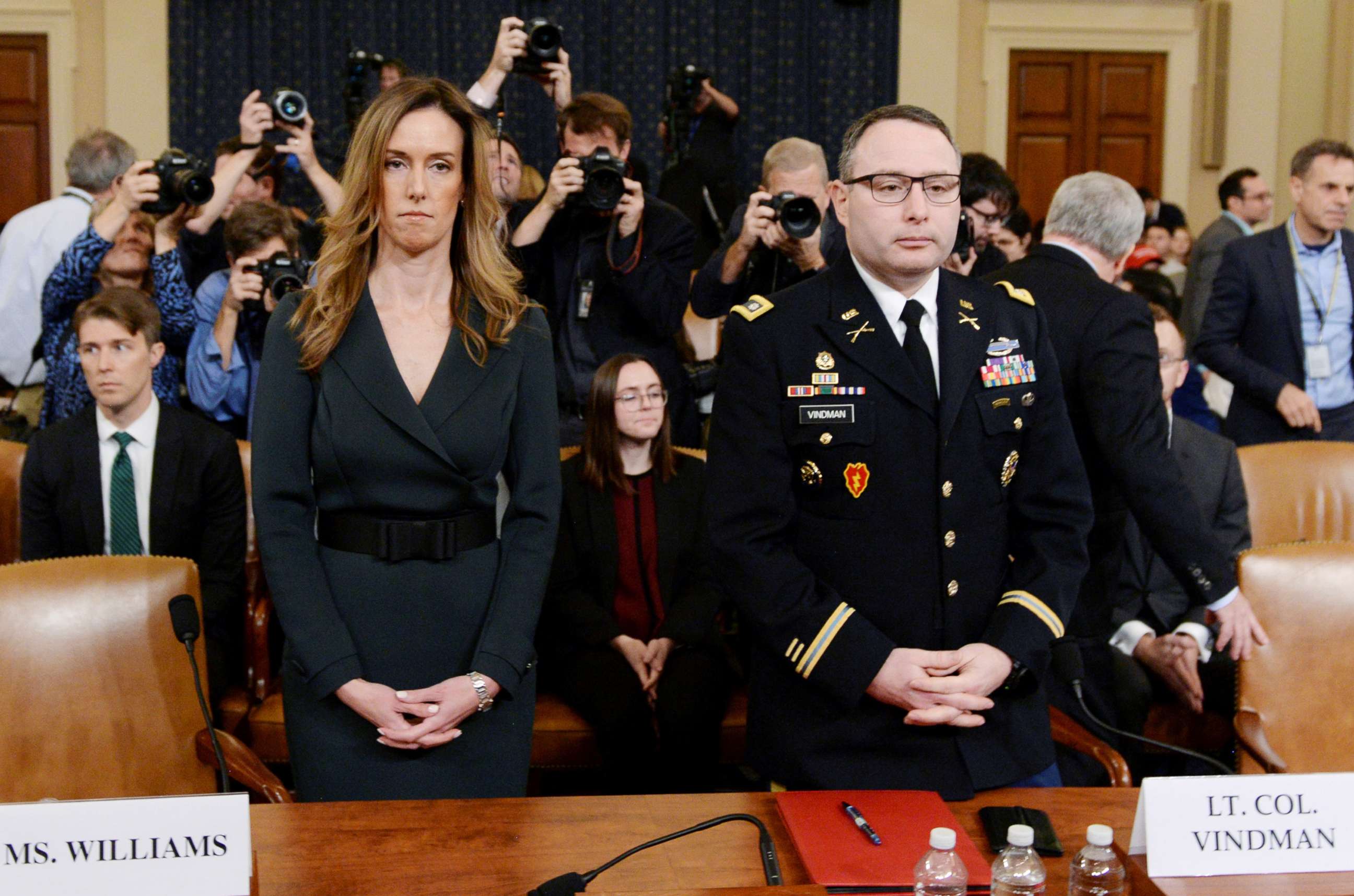 PHOTO: Jennifer Williams and Lt. Colonel Alexander Vindman take their seats to testify before a House Intelligence Committee hearing as part of the impeachment inquiry into President Donald Trump on Capitol Hill in Washington, D.C., Nov. 19, 2019.