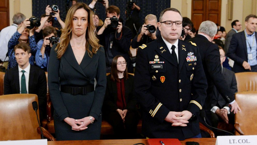 PHOTO: Jennifer Williams and Lt. Colonel Alexander Vindman take their seats to testify before a House Intelligence Committee hearing as part of the impeachment inquiry into President Donald Trump on Capitol Hill in Washington, D.C., Nov. 19, 2019.