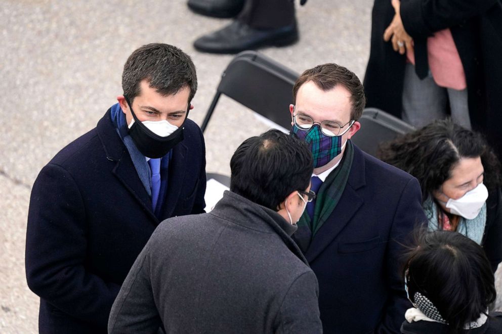 PHOTO: Transportation Secretary-designate Pete Buttigieg stands with his husband Chasten Buttigieg and others before the 59th Presidential Inauguration at the U.S. Capitol in Washington, Jan. 20, 2021.