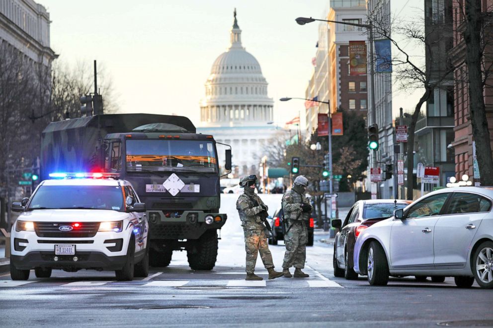 PHOTO: Members of the National Guard patrol a street leading to the U.S. Capitol ahead of the inauguration of U.S. President-elect Joe Biden on Jan. 20, 2021 in Washington, D.C. Law enforcement and state officials are on high alert.