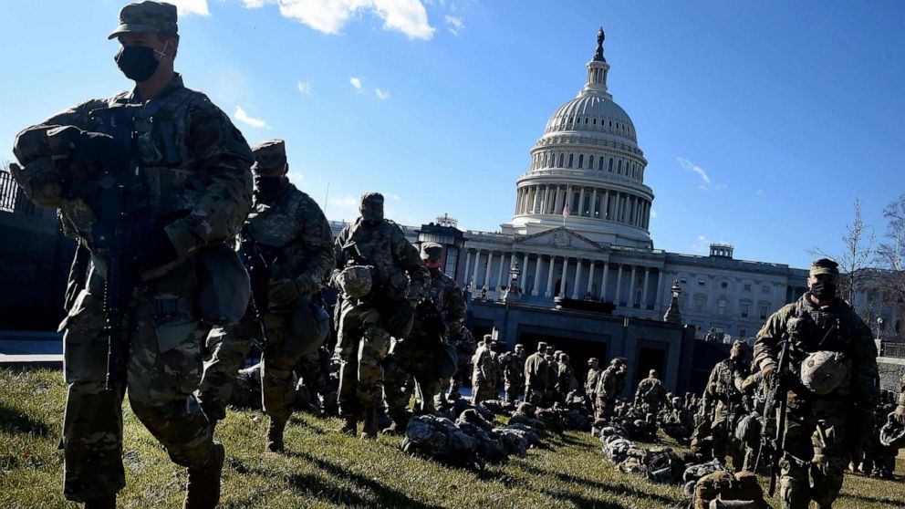 PHOTO: Members of the National Guard gather near the U.S. Capitol, ahead of the 59th inaugural ceremony for President-elect Joe Biden and Vice President-elect Kamala Harris in Washington, D.C., Jan. 19, 2021.